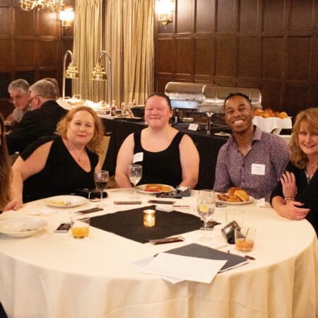 a group of people sitting at a table