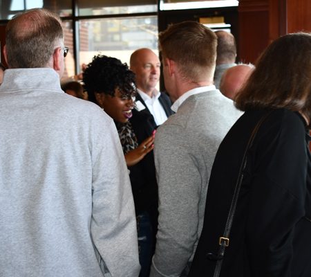 a group of people standing in a room