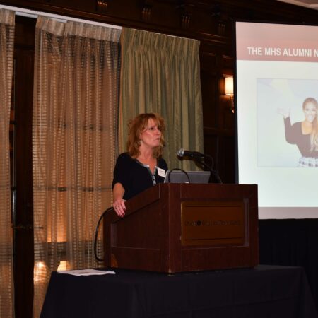 a person standing at a podium