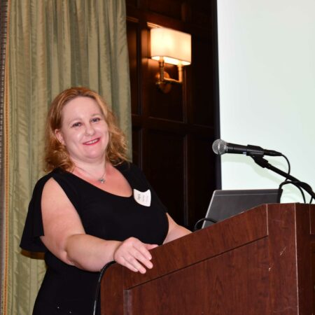 a person standing at a podium