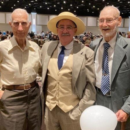 a group of men posing for a photo