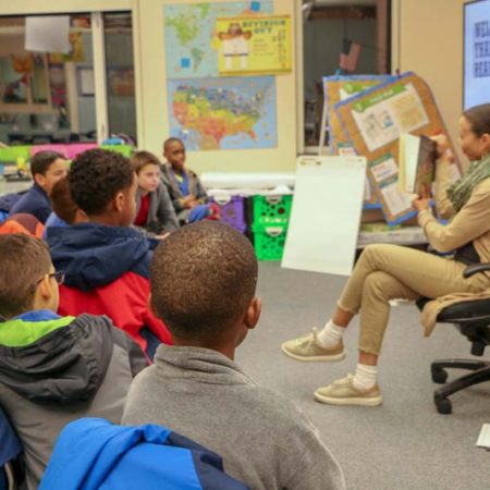 a teacher teaching a group of children