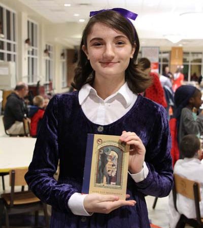 a child holding a book