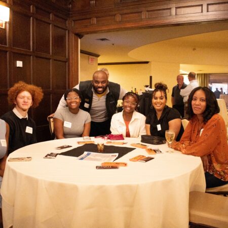 a group of people sitting at a table