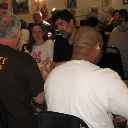 a group of people sitting around a table