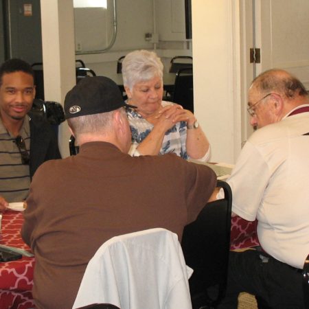 a group of people sitting around a table