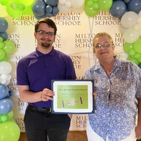 MHS senior Jaymes Forgen receives the Milton Hershey School Alumni Association Delaware, Maryland, and Virginia Chapter's Community Service Award