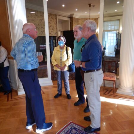 a group of men standing in a room