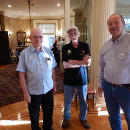 a group of men standing in a room