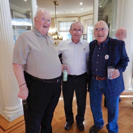 a group of men standing in a room