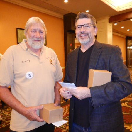 a couple of men holding boxes