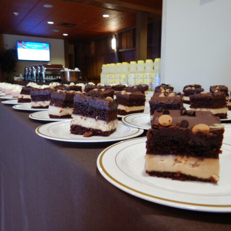 a row of desserts on plates