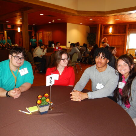 a group of people sitting at a table