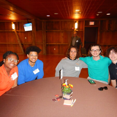 a group of people sitting at a table