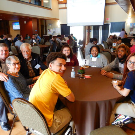 a group of people sitting at a table