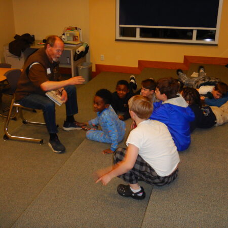 a group of children sitting on the floor