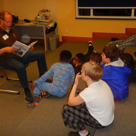 a group of people sitting on the floor