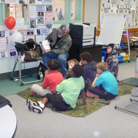 a group of children sitting on the floor