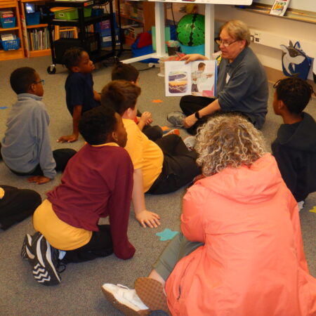 a group of children sitting on the floor