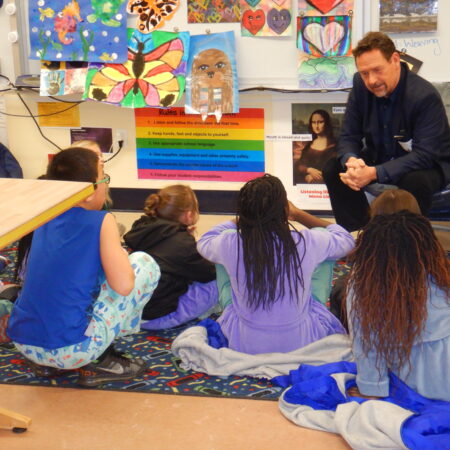 a group of children sitting on the floor