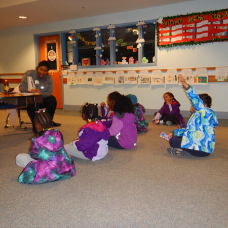 a group of children sitting on the floor