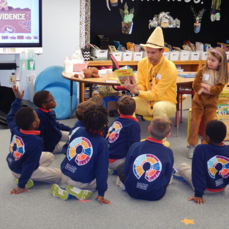 a group of children sitting on the floor