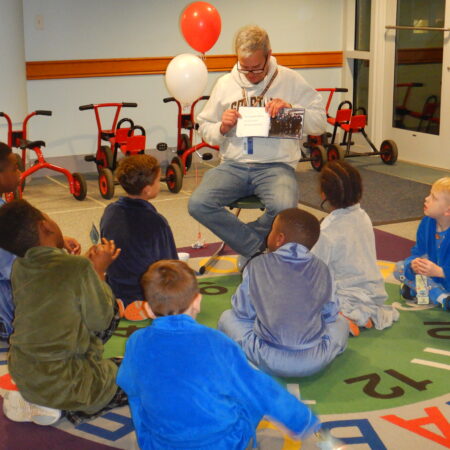 a group of children sitting on the floor