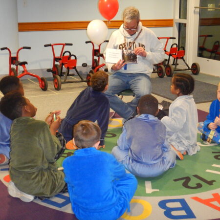 a group of children sitting on the floor