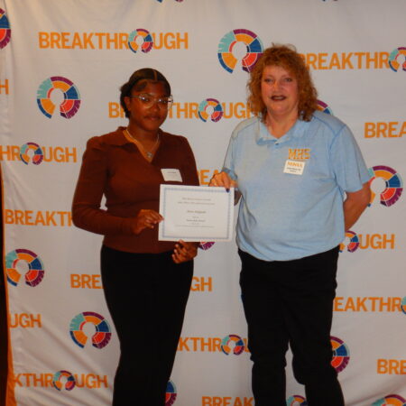 a few women holding a certificate