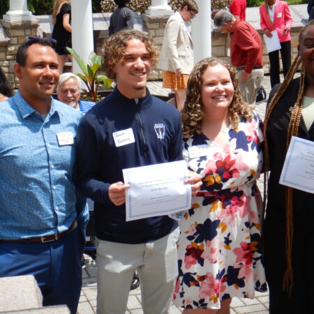 a group of people holding papers
