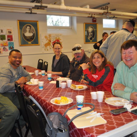 a group of people sitting at a table