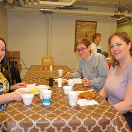 a group of people sitting at a table