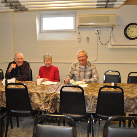 a group of people sitting at a table