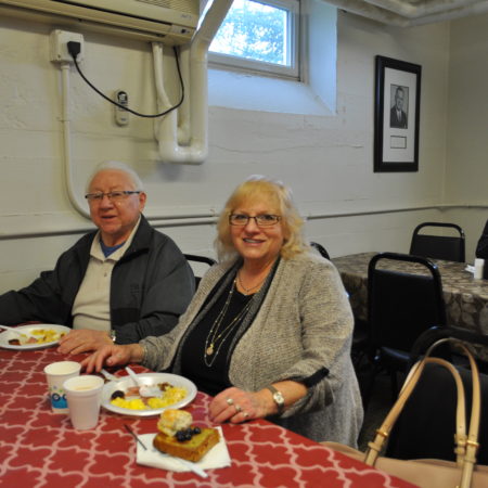 a couple of people sitting at a table