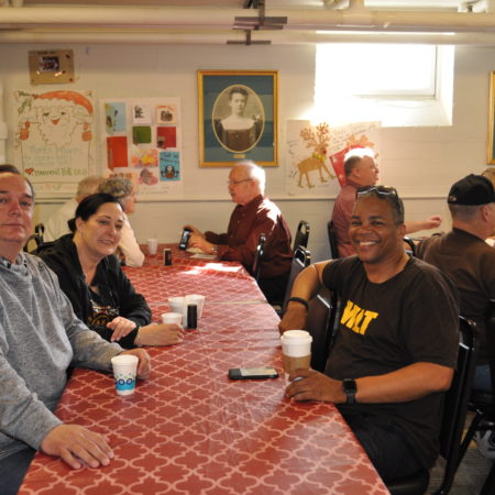a group of people sitting at a table