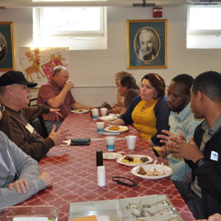 a group of people sitting around a table