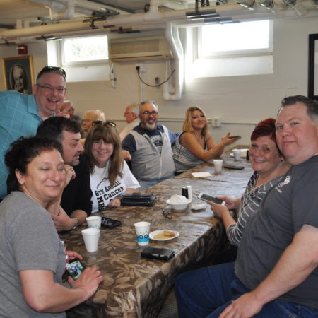 a group of people sitting around a table