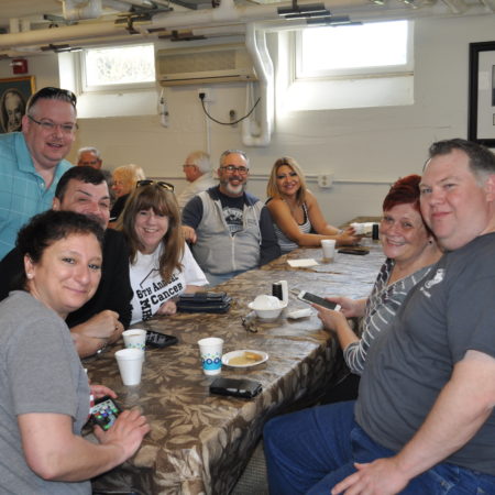 a group of people sitting around a table