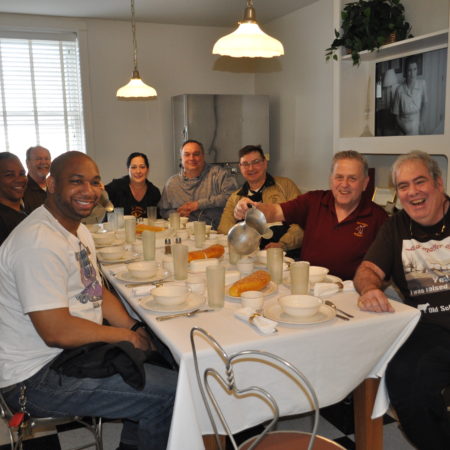 a group of people sitting around a table