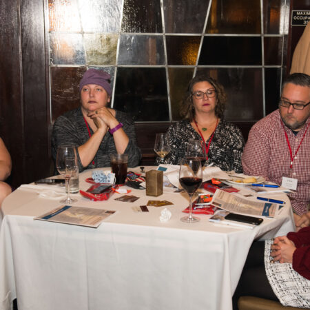 a group of people sitting at a table