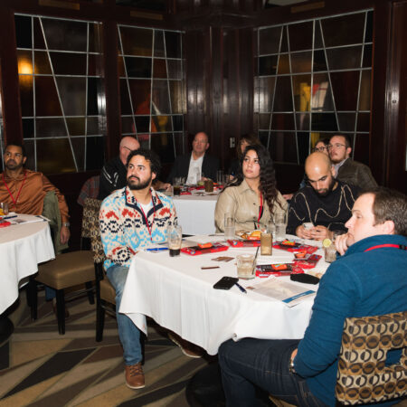a group of people sitting at tables