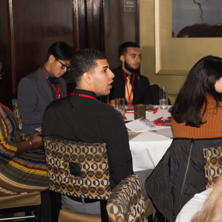 a group of people sitting at a table