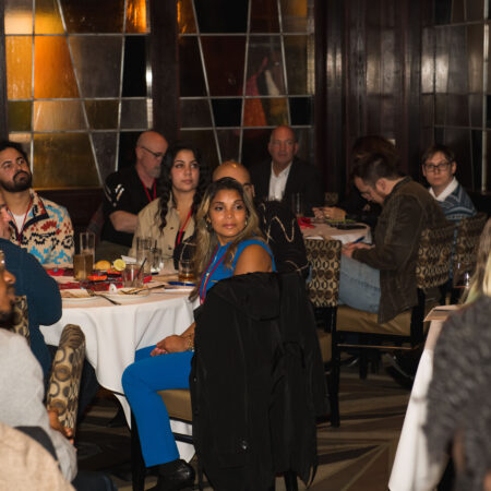 a group of people sitting at tables