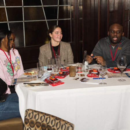 a group of people sitting at a table