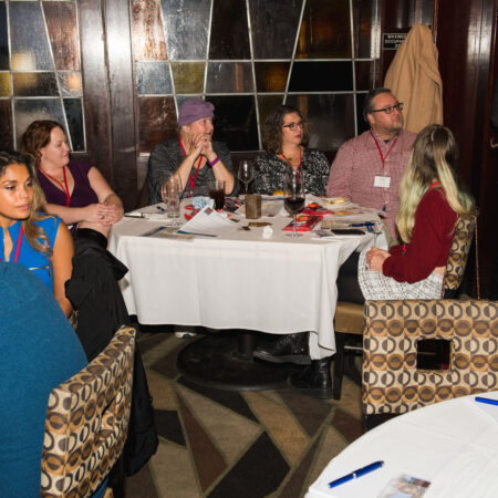 a group of people sitting around a table