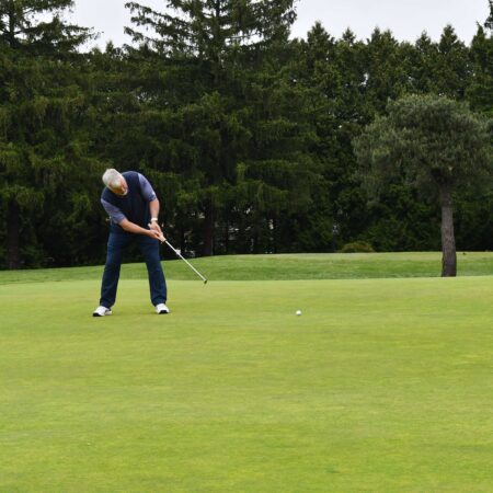 a person playing golf on a golf course