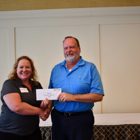 people holding a check