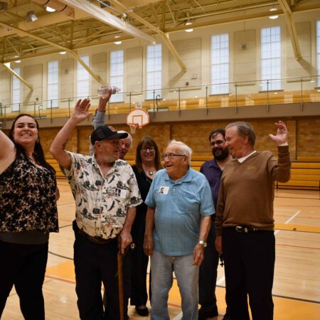 a group of people in a gym