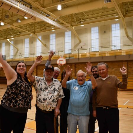 a group of people in a gym