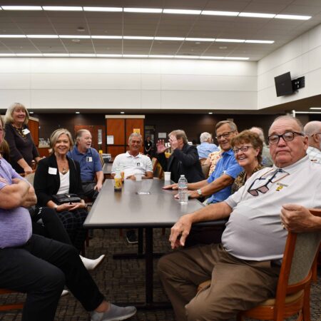 a group of people sitting around a table